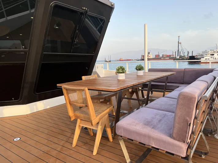 Bad Company Support Yacht Photos Pics Deck area of Damen YS 4508 yacht with table and chairs, 2019.