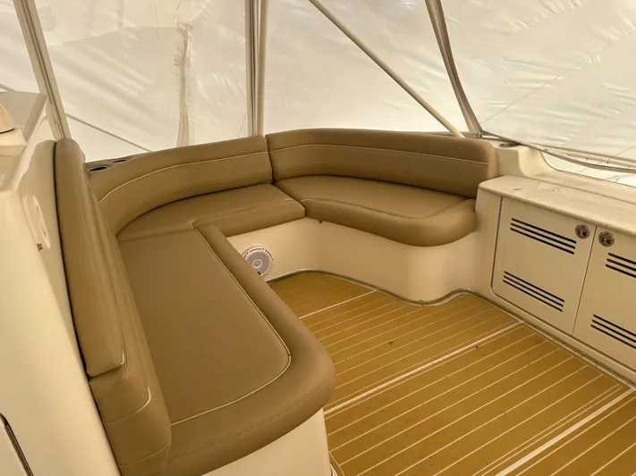  Yacht Photos Pics 2006 Silverton 48 Convertible boat interior with tan leather seating and wooden flooring.