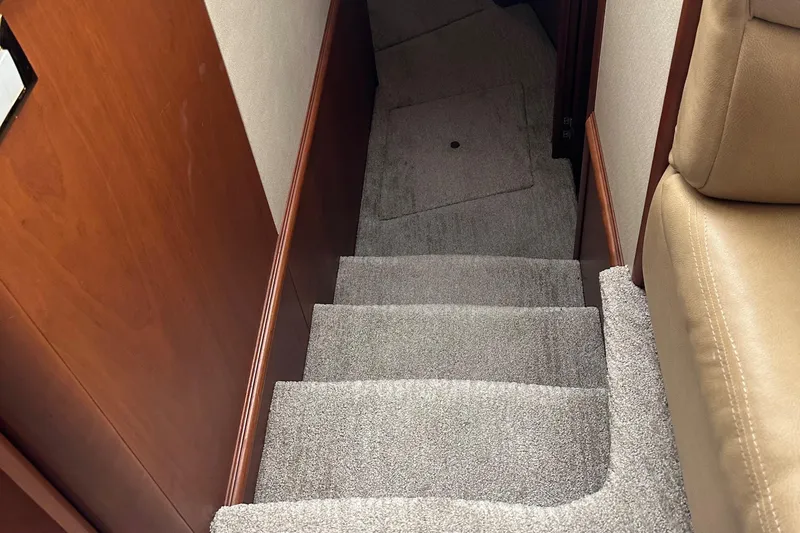  Yacht Photos Pics Carpeted stairs inside a 2006 Silverton 48 Convertible yacht.