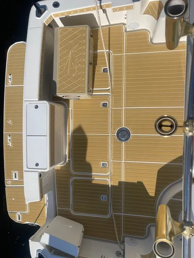  Yacht Photos Pics 2006 Silverton 48 Convertible boat deck with teak flooring and storage compartments.