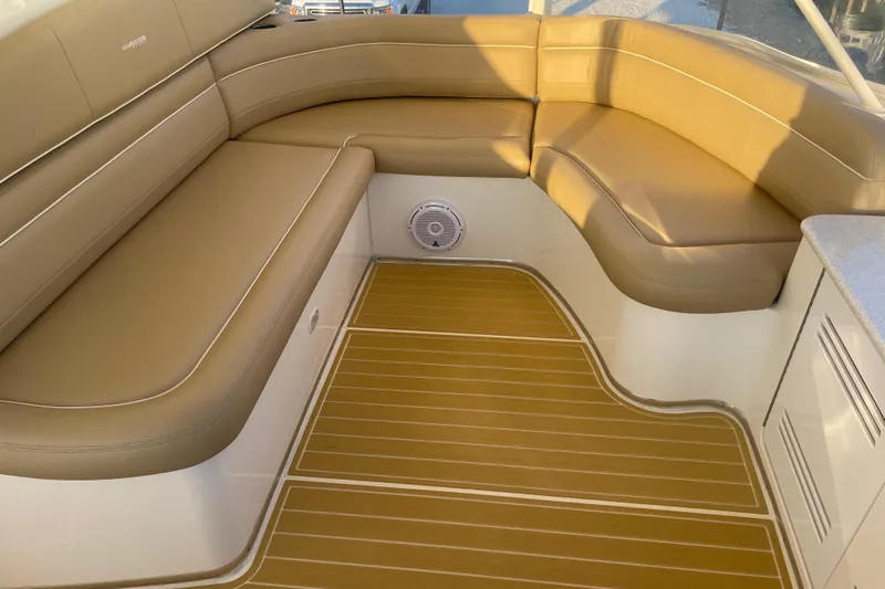  Yacht Photos Pics 2006 Silverton 48 Convertible boat with tan leather seating and teak flooring.