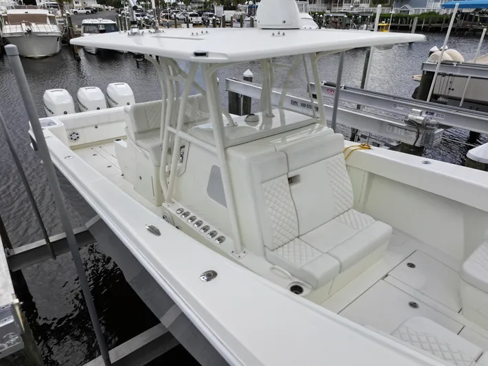  Yacht Photos Pics 2017 SeaVee 370z boat with white seating, docked in a marina.