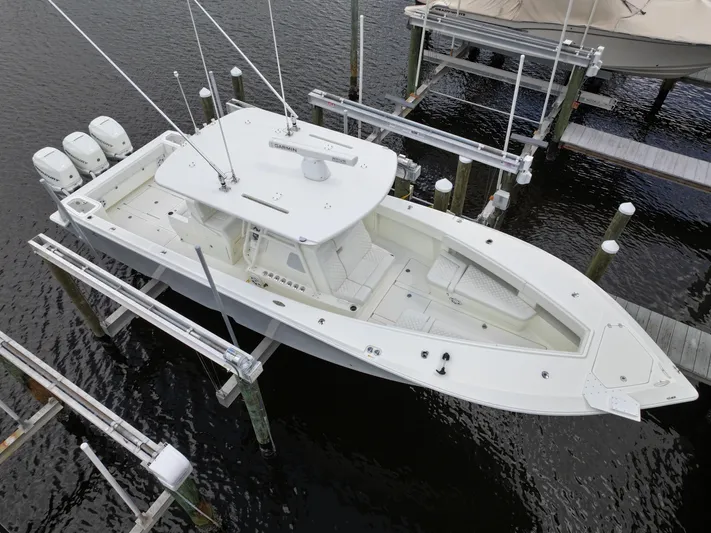  Yacht Photos Pics Aerial view of 2017 SeaVee 370z boat docked with triple outboard engines.