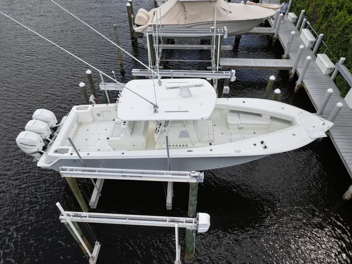  Yacht Photos Pics 2017 SeaVee 370z boat docked with triple outboard engines.