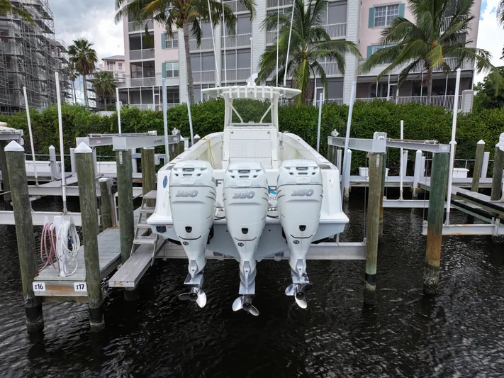  Yacht Photos Pics 2017 SeaVee 370z boat with triple outboard engines docked at marina.