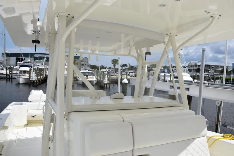  Yacht Photos Pics 2017 SeaVee 370z boat interior at marina, showcasing helm and seating area.
