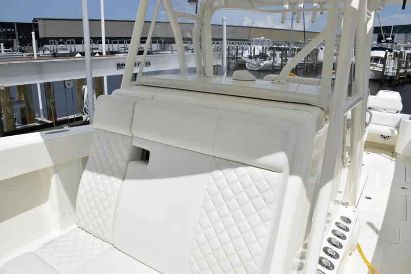  Yacht Photos Pics 2017 SeaVee 370z boat with white quilted seating at a marina.