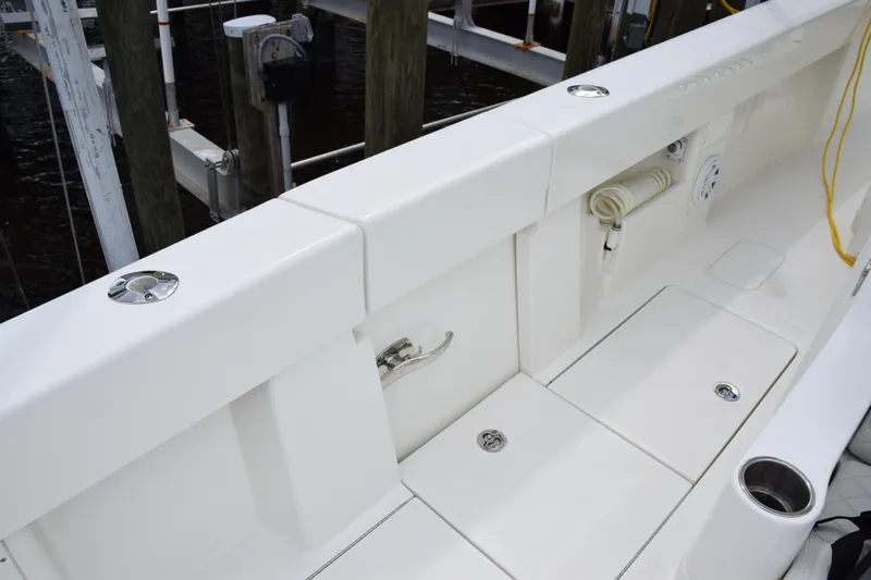  Yacht Photos Pics 2017 SeaVee 370z boat deck with storage compartments and rod holders.