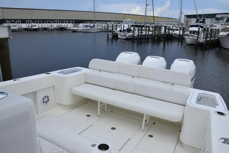  Yacht Photos Pics 2017 SeaVee 370z boat with spacious seating, docked at a marina.