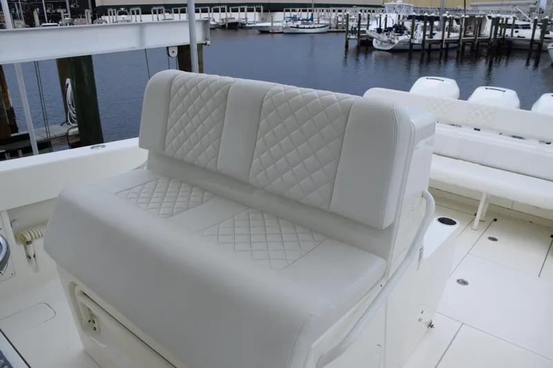  Yacht Photos Pics 2017 SeaVee 370z boat with white quilted seating, docked at marina.