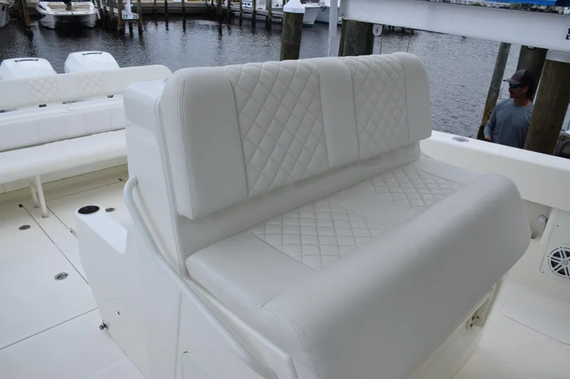  Yacht Photos Pics 2017 SeaVee 370z boat with white quilted seating by the dock.