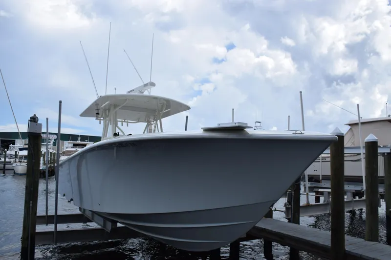  Yacht Photos Pics 2017 SeaVee 370z boat docked at marina under cloudy sky.