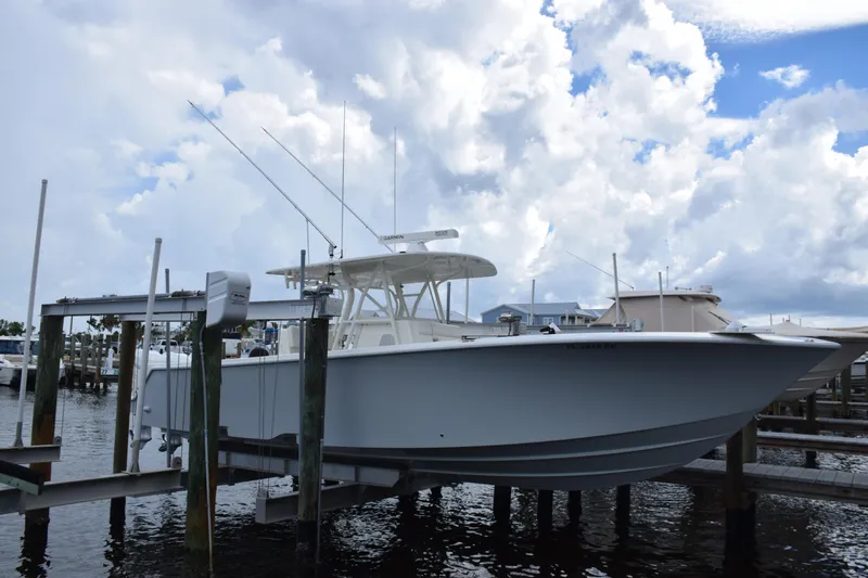  Yacht Photos Pics 2017 SeaVee 370z boat docked under cloudy sky.
