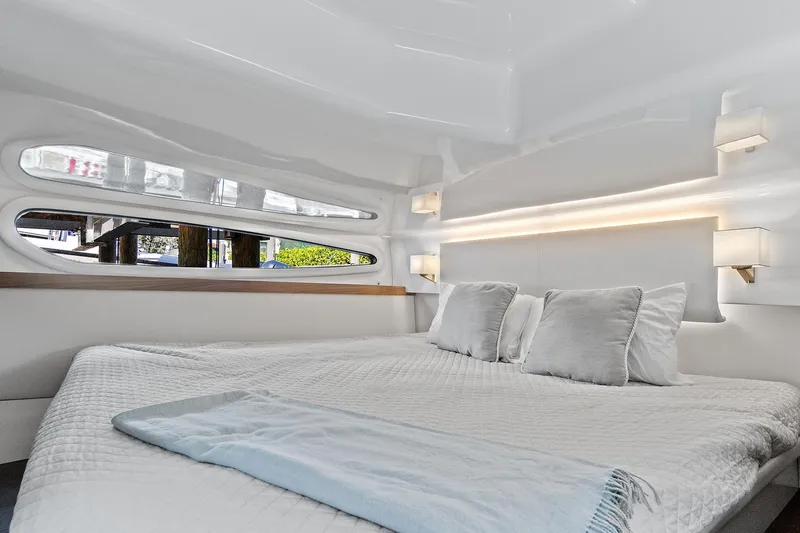 "seadancer" Yacht Photos Pics Luxurious interior cabin of 2022 Regal 38 XO yacht with modern bedding.