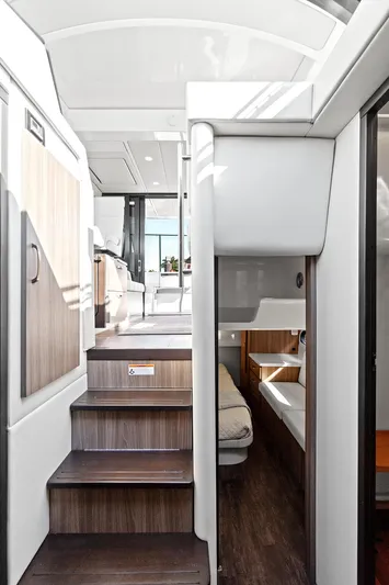 "seadancer" Yacht Photos Pics Interior of 2022 Regal 38 XO yacht, featuring modern design and wooden stairs.