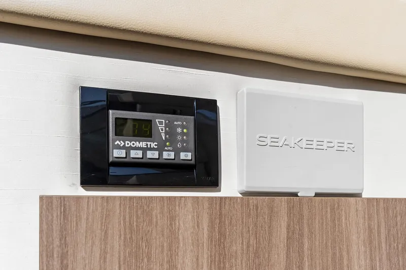"seadancer" Yacht Photos Pics Dometic and Seakeeper control panels on 2022 Regal 38 XO yacht interior.