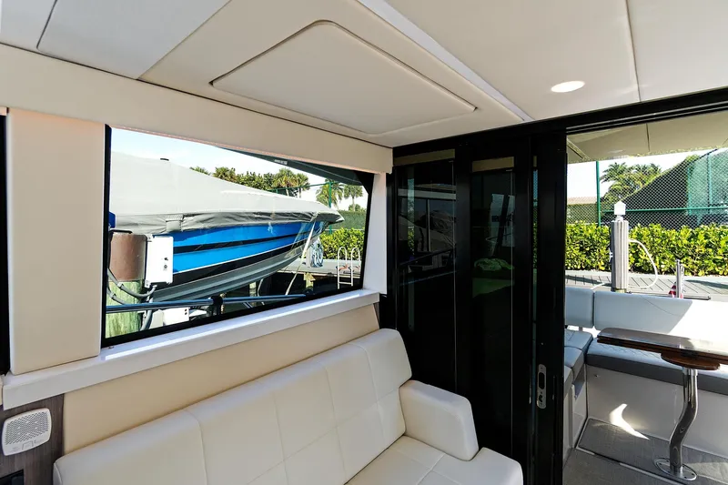 "seadancer" Yacht Photos Pics Interior view of 2022 Regal 38 XO yacht with seating and outdoor access.