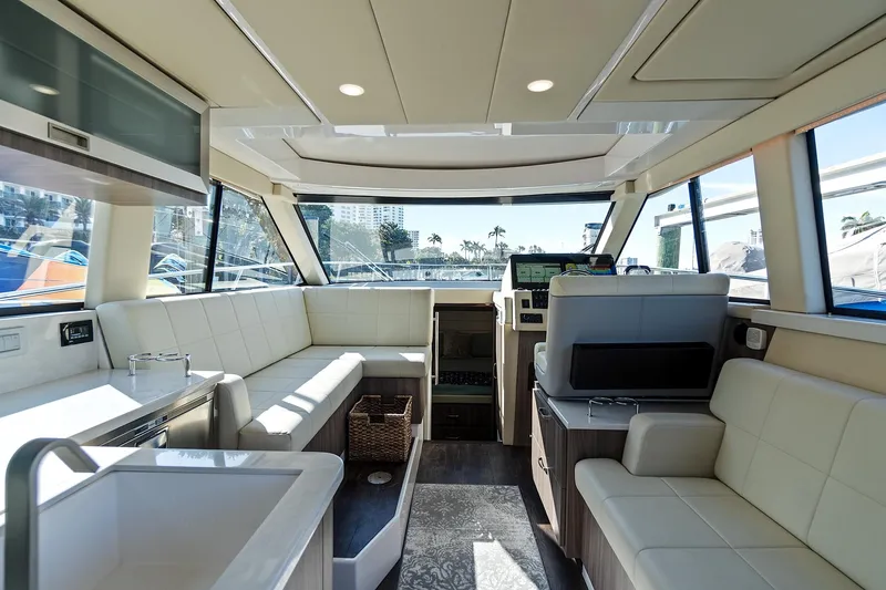 "seadancer" Yacht Photos Pics Luxurious interior of 2022 Regal 38 XO yacht with modern seating and panoramic windows.