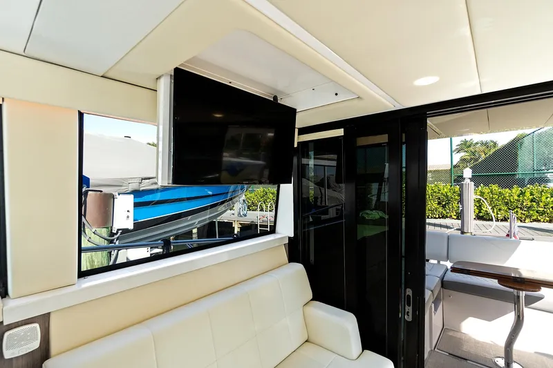 "seadancer" Yacht Photos Pics Interior of 2022 Regal 38 XO yacht with TV and seating area.