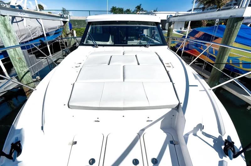 "seadancer" Yacht Photos Pics 2022 Regal 38 XO yacht with sleek white deck, docked at marina.