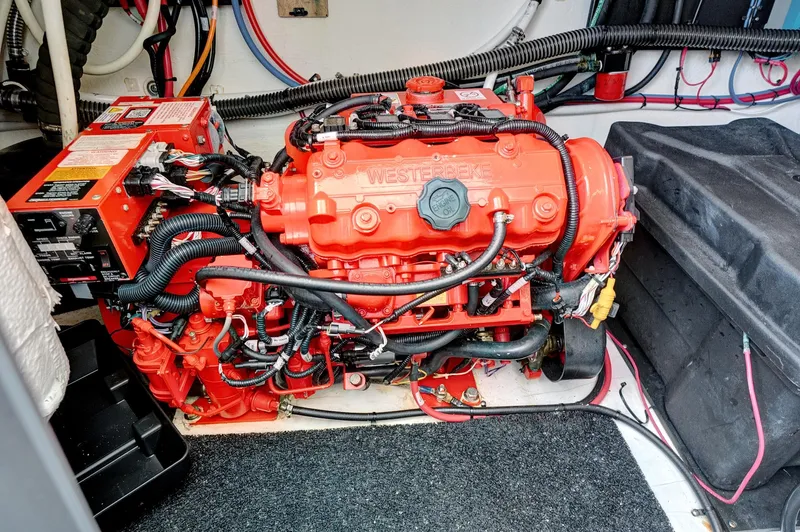 "seadancer" Yacht Photos Pics Engine compartment of a 2022 Regal 38 XO boat, featuring a red Westebeke engine.