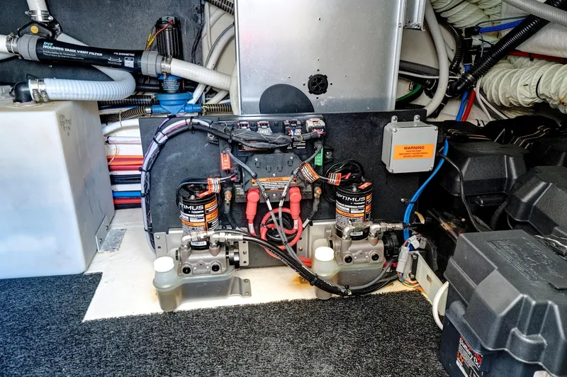 "seadancer" Yacht Photos Pics Engine compartment of 2022 Regal 38 XO boat, showcasing wiring and battery systems.