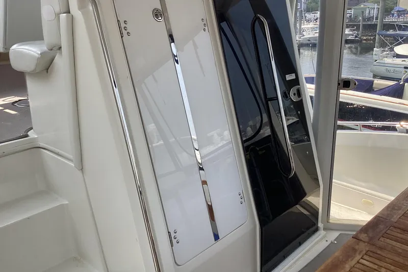 Fun Coupons Yacht Photos Pics 2005 Carver 41 Cockpit Motor Yacht interior with sleek design and marina view.