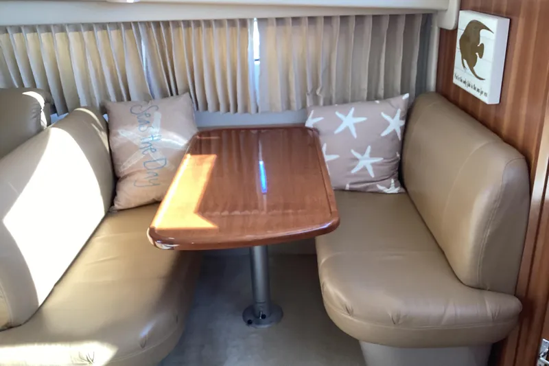 Fun Coupons Yacht Photos Pics Interior of 2005 Carver 41 Cockpit Motor Yacht with cozy seating and decorative pillows.