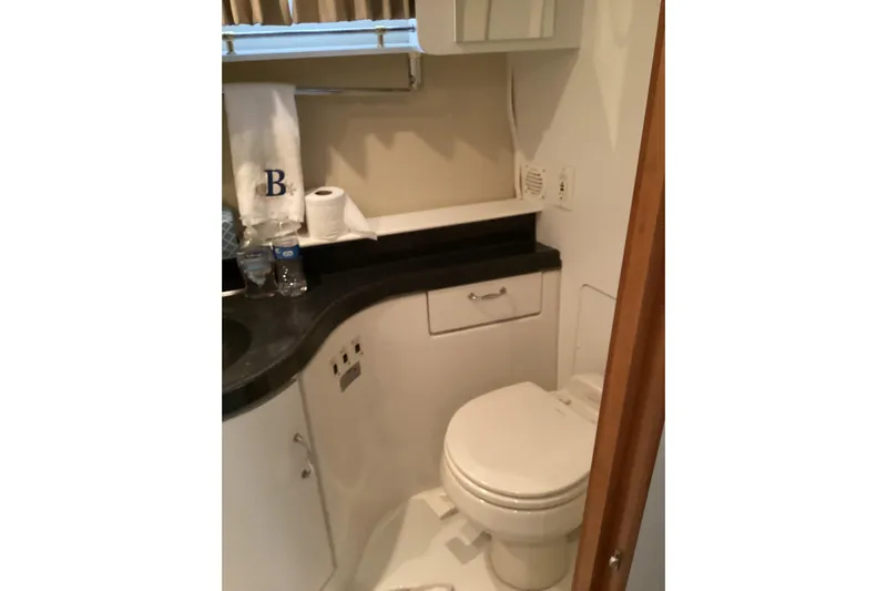 Fun Coupons Yacht Photos Pics Bathroom interior of 2005 Carver 41 Cockpit Motor Yacht with modern amenities.