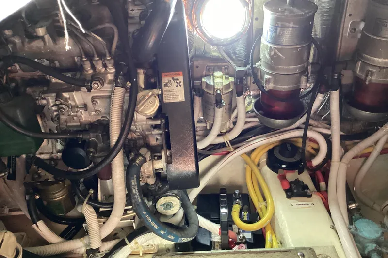 Fun Coupons Yacht Photos Pics Engine room of 2005 Carver 41 Cockpit Motor Yacht with visible components and wiring.