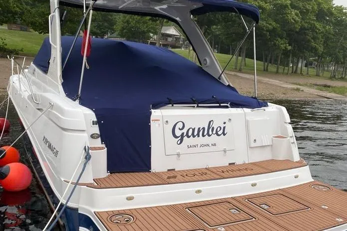  Yacht Photos Pics 2007 Four Winns 278 Vista boat docked by a lakeside with blue cover.