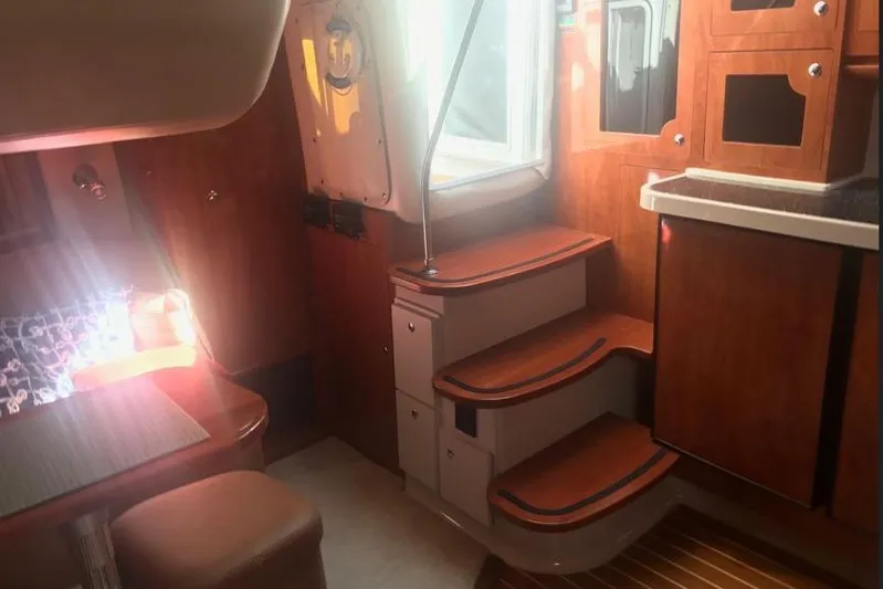  Yacht Photos Pics Interior of 2007 Four Winns 278 Vista boat with wooden cabinetry and steps.