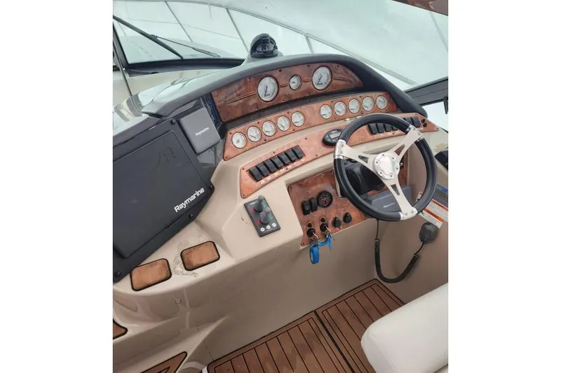  Yacht Photos Pics 2007 Four Winns 278 Vista boat dashboard with steering wheel and navigation controls.