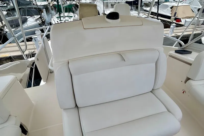 Redeye Yacht Photos Pics Luxurious seating on a 2012 Tiara Yachts 48 CNV, docked at a marina.