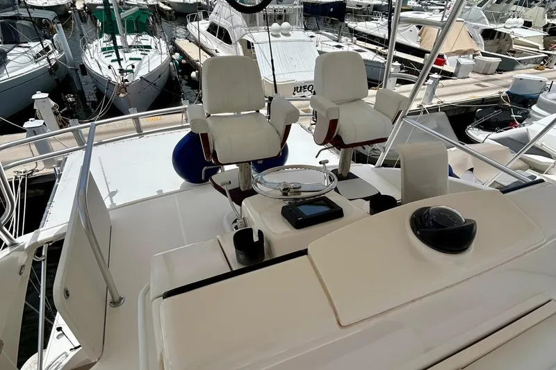 Redeye Yacht Photos Pics Cockpit of 2012 Tiara Yachts 48 CNV with helm chairs and navigation equipment.