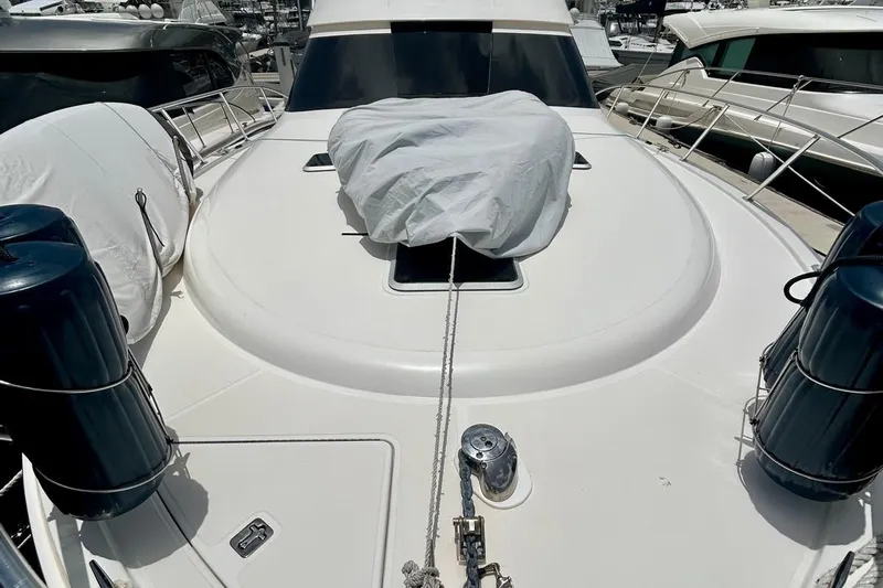 Redeye Yacht Photos Pics 2012 Tiara Yachts 48 CNV boat deck with covered hatch and mooring equipment.
