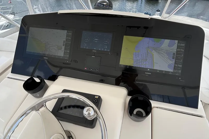 Redeye Yacht Photos Pics Tiara Yachts 48 CNV 2012 helm with Garmin navigation displays and steering wheel.