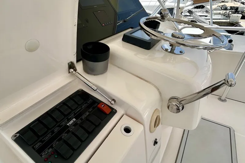 Redeye Yacht Photos Pics Control panel and steering wheel of a 2012 Tiara Yachts 48 CNV boat.