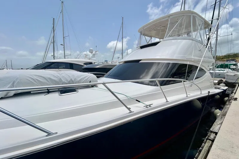 Redeye Yacht Photos Pics 2012 Tiara Yachts 48 CNV docked, showcasing sleek design and spacious deck.