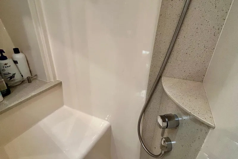 Redeye Yacht Photos Pics Shower area in 2012 Tiara Yachts 48 CNV with modern fixtures and toiletries.