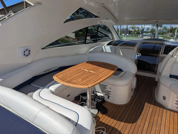  Yacht Photos Pics Interior of 2007 Fairline Targa 52 GT yacht with wooden table and white seating.