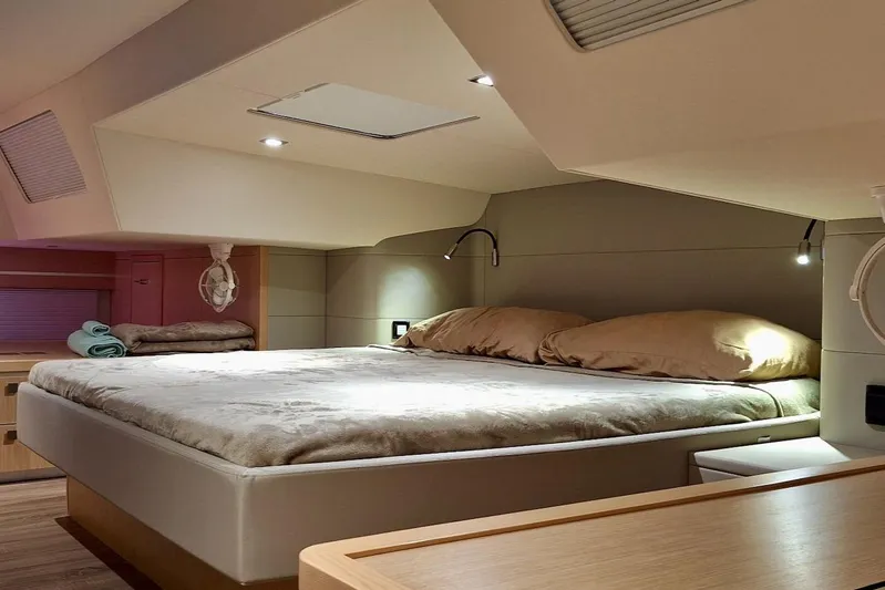 Emmanuel Yacht Photos Pics Luxurious cabin interior of 2023 Privilege Signature 510 yacht with cozy bedding.