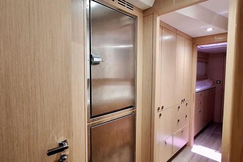 Emmanuel Yacht Photos Pics Luxurious interior of 2023 Privilege Signature 510 yacht with sleek wood cabinetry.