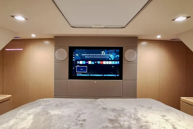 Emmanuel Yacht Photos Pics Luxurious interior of 2023 Privilege Signature 510 yacht with modern entertainment system.