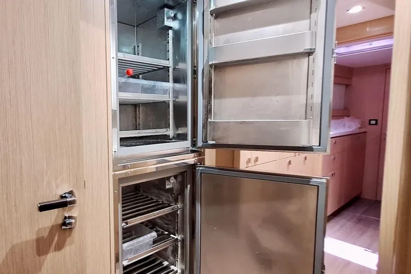 Emmanuel Yacht Photos Pics Open stainless steel refrigerator in 2023 Privilege Signature 510 yacht interior.