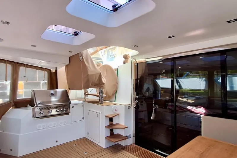 Emmanuel Yacht Photos Pics Luxurious interior of 2023 Privilege Signature 510 yacht with modern kitchen and seating area.