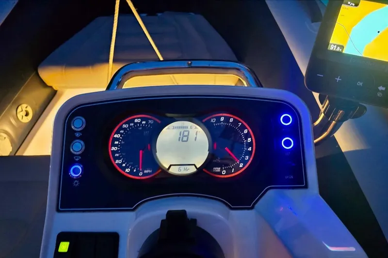 Emmanuel Yacht Photos Pics Dashboard of 2023 Privilege Signature 510 boat with illuminated gauges and navigation screen.