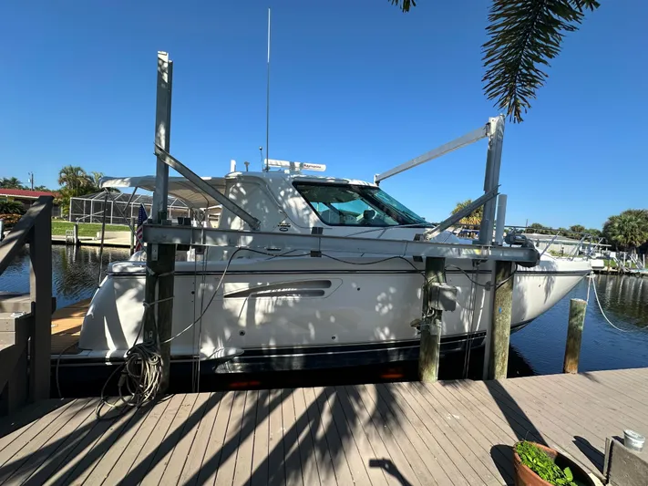  Yacht Photos Pics 2005 Tiara Yachts 3600 Sovran docked by a sunny waterfront.
