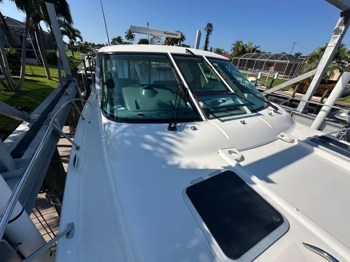  Yacht Photos Pics 2005 Tiara Yachts 3600 Sovran docked, showcasing sleek design and spacious deck.