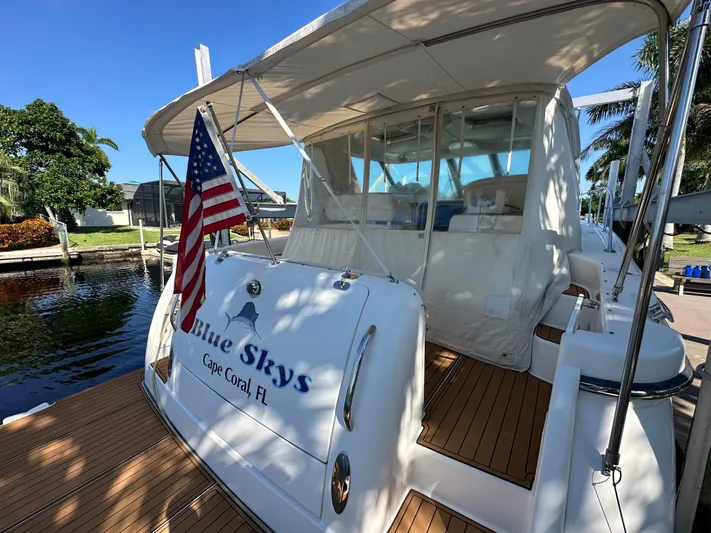  Yacht Photos Pics 2005 Tiara Yachts 3600 Sovran docked, featuring "Blue Skys" name and American flag.